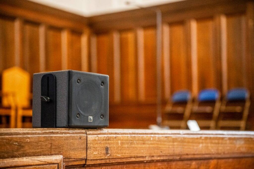 L-Acoustics 5XT point source loudspeakers are spaced on the ground at the front of the stage, ensuring precise sound distribution throughout the Great Hall 