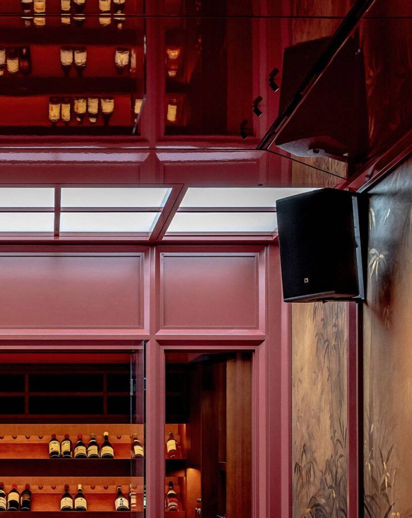 Subwoofers were cleverly hidden within the furniture, maintaining the luxurious appearance of the room, with the only visible elements being the ceiling-mounted speakers.