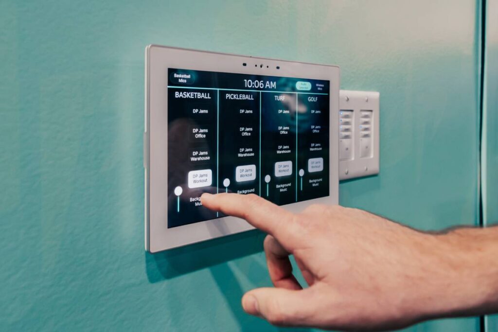 Extron control panels are used to select audio sources for gym zones