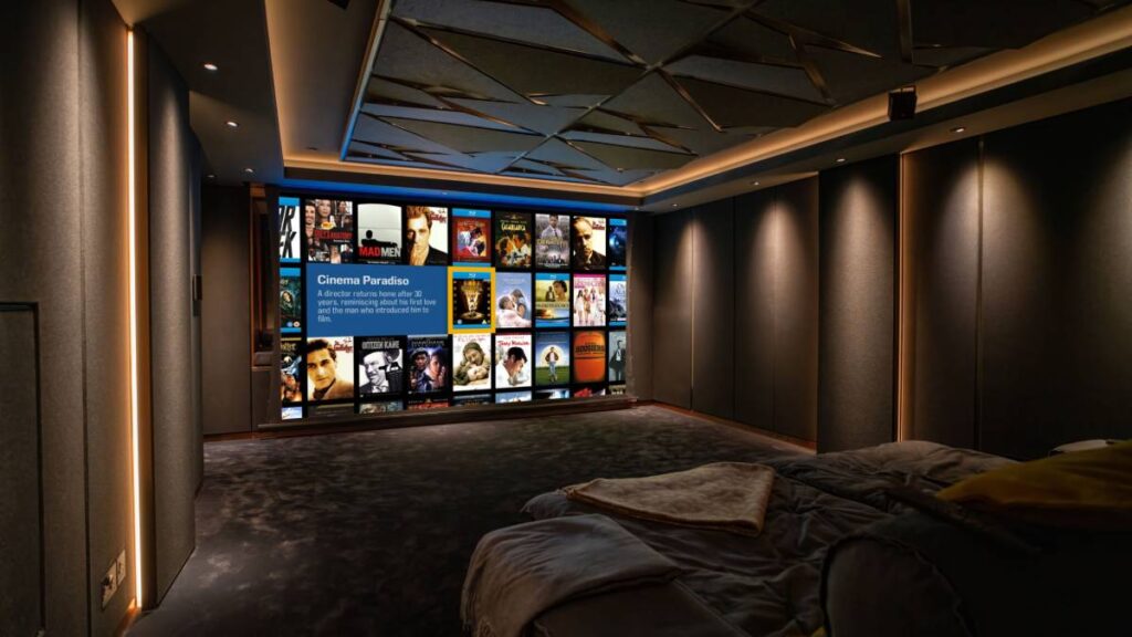 The transformed Westminster cinema room featuring L-Acoustics audio system with 3.3m drop-down screen and professional acoustic treatments. 