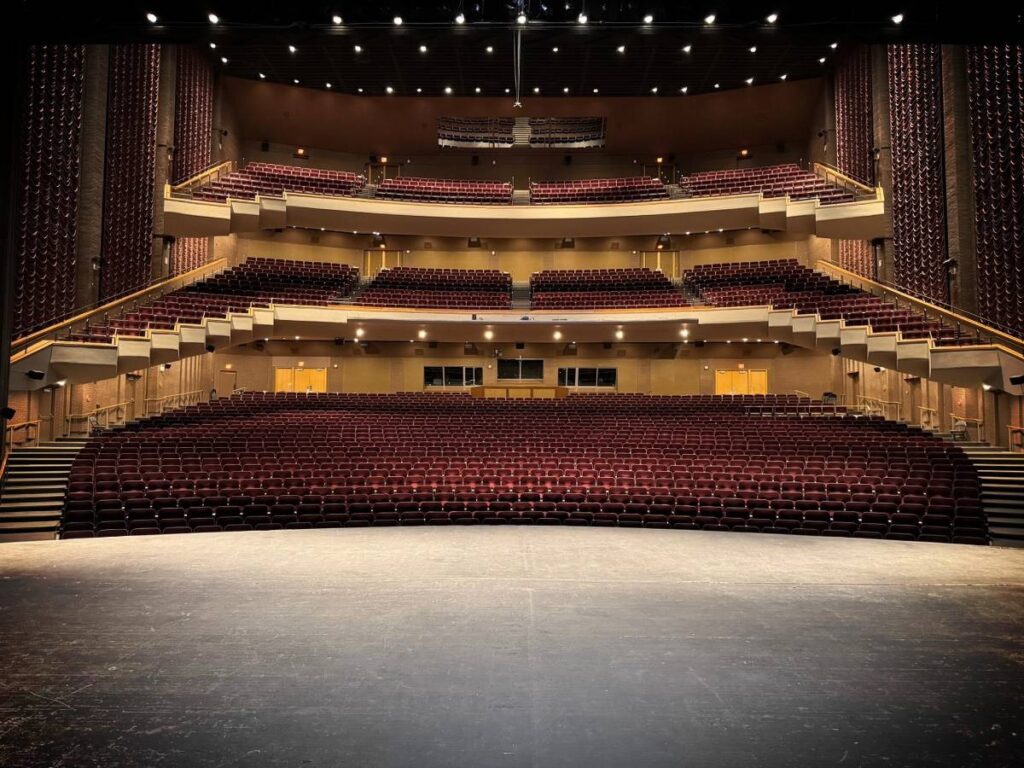 Fifty-three L-Acoustics X8 coaxials are deployed as under-balcony, front stage-lip, and surround-fills in the house