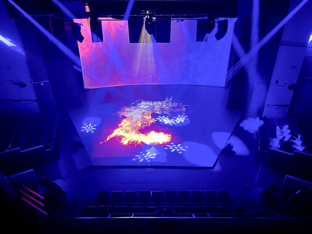 Projection mapping that can incorporate live video covers the stage floor