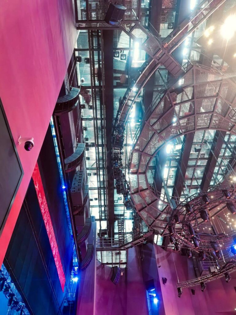 The frontal L-ISA Scene System comprises A15i Focus and Wide arrays with centrally flown KS28 subwoofers in cardioid configuration, delivering precise spatial audio across the theatre's unique dual-mode stage